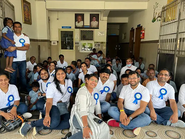 Bioplus employees spending time with residents during a community outreach visit